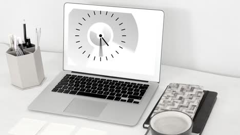Animation-of-clock-moving-fast-on-laptop-screen-on-desk