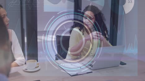 Animation-of-round-scanner-and-data-processing-over-biracial-woman-talking-to-a-colleague-at-office
