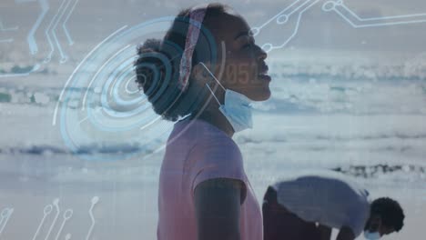 Animation-of-round-scanner-and-data-processing-over-african-american-woman-enjoying-at-the-beach