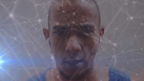 Animation-Von-Lichtspuren-Und-Netzwerk-Von-Verbindungen-über-Einem-Afroamerikanischen-Mann