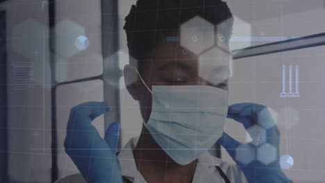 Animation-of-data-processing-over-african-american-female-doctor-in-face-mask