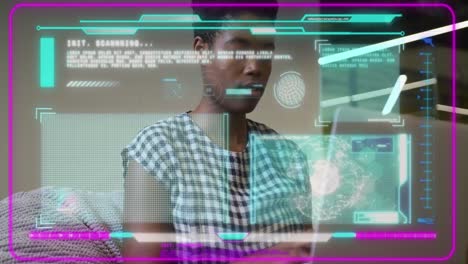Animation-of-data-processing-over-african-american-businesswoman-using-laptop