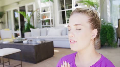 Relaxed-caucasian-plus-size-woman-practicing-yoga-and-meditating-in-slow-motion