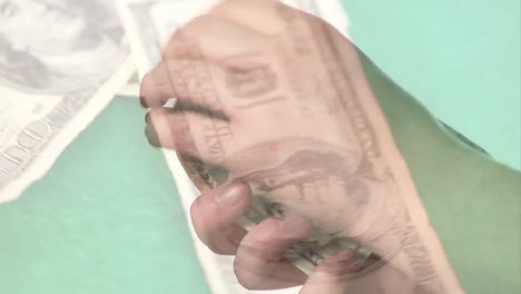 Animation-of-american-dollar-banknotes-falling-over-hands-counting-american-dollar-banknotes