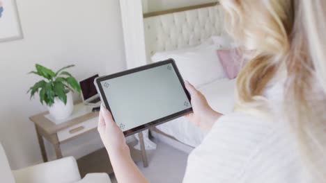 Caucasian-plus-size-woman-using-tablet-with-copy-space-in-slow-motion