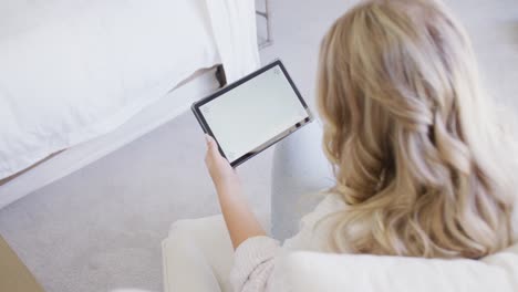Caucasian-plus-size-woman-using-tablet-with-copy-space-in-slow-motion