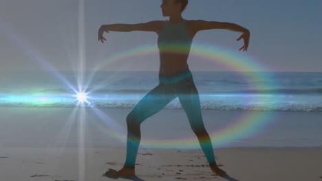 Animation-Von-Lichtflecken-über-Einer-Kaukasischen-Frau,-Die-Am-Strand-Yoga-Praktiziert