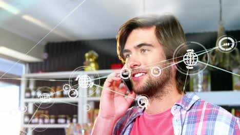 Animation-of-caucasian-man-talking-on-smartphone-over-network-of-connections-with-icons