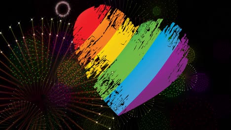 Animation-of-pride-rainbow-heart-and-fireworks-exploding-on-black-background
