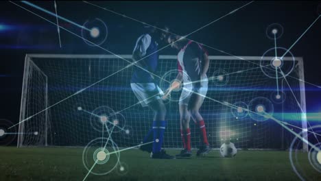 Animation-of-network-of-connections-with-icons-over-diverse-football-players-kicking-ball-on-pitch