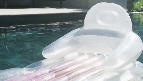 Transparent-inflatable-in-swimming-pool-in-garden-on-sunny-day
