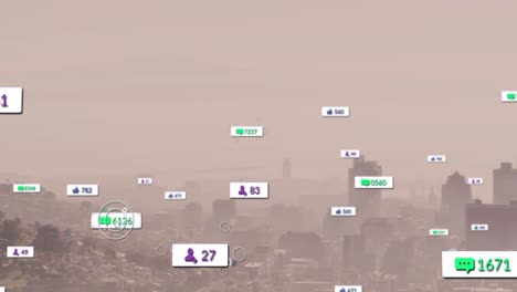 Animation-of-notification-labels-and-numbers-over-aerial-view-of-fog-covered-mountain-and-cityscape