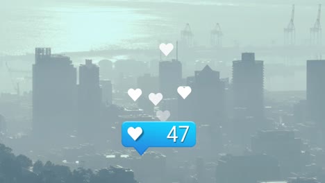 Animation-of-heart-icon-with-increasing-numbers-aerial-view-of-cityscape