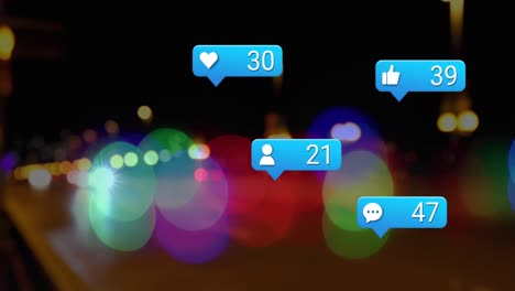 Animation-of-social-media-icons-and-spots-of-light-against-blurred-view-of-night-city-traffic