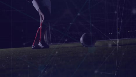 Animation-of-connected-dots-over-low-section-of-soccer-player-playing-with-football-on-ground