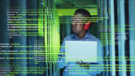 Animation-of-data-processing-over-african-american-male-engineer-using-laptop-at-server-room