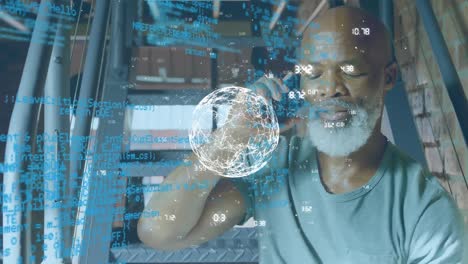 Animation-of-computer-language-and-numbers-around-globe,-african-american-man-talking-on-cellphone