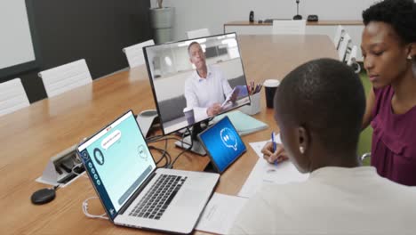 African-american-business-people-having-video-call-and-using-laptop-with-digital-chat-in-office