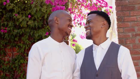 Portrait-of-happy-african-american-gay-male-couple-at-wedding,-slow-motion