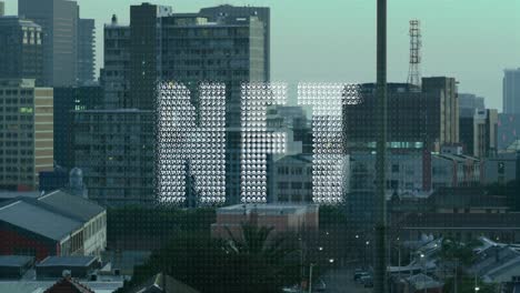 Animation-of-nft-text-banner-against-aerial-view-of-cityscape