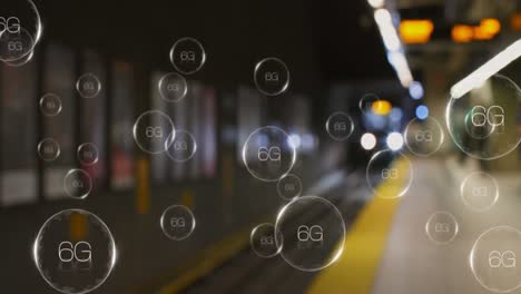 Animation-of-6g-text-in-bubbles-over-train-arriving-at-subway-station