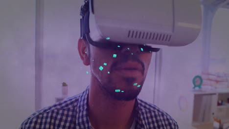 Animation-of-shapes-moving-over-biracial-businessman-using-vr-headset
