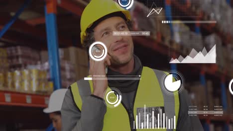 Animation-of-data-processing-over-caucasian-male-worker-talking-on-smartphone-at-warehouse