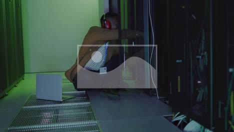 Animation-of-binary-coding-and-male-african-american-it-engineer-and-computer-servers