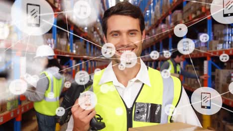 Animation-of-network-of-icons-on-caucasian-male-worker-holding-box-and-scanning-device-at-warehouse