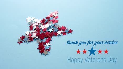 Animation-of-veterans-day-text-and-stars-over-star-on-blue-background