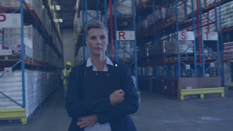 Animation-of-connected-icons-over-short-hair-caucasian-woman-standing-with-notepad-in-warehouse