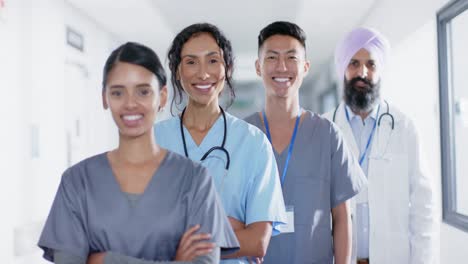 Portrait-of-diverse-doctors-and-nurses-smiling-in-corridor-at-hospital,-in-slow-motion