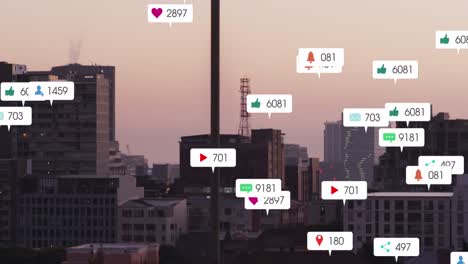Animation-of-social-media-icons-against-aerial-view-of-cityscape