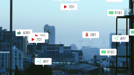 Animation-of-social-media-icons-against-aerial-view-of-cityscape