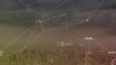 Animation-of-connected-dots-with-graph-icons-over-modern-cityscape-against-cloudy-sky
