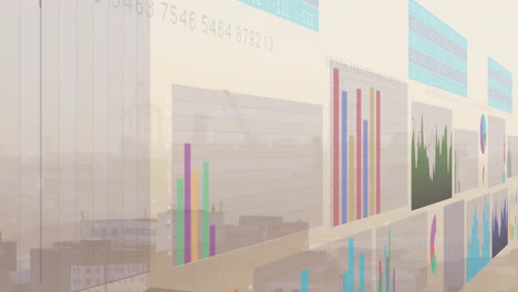 Animation-of-multicolored-graphs-over-fog-covered-modern-city-against-sky