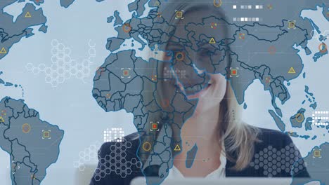 Animation-of-financial-data-processing-with-world-map-over-caucasian-businesswoman-using-laptop