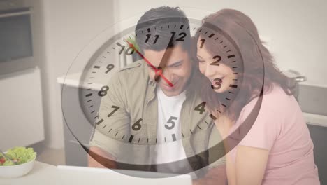 Animation-of-clock-ticking-over-diverse-couple-using-tablet