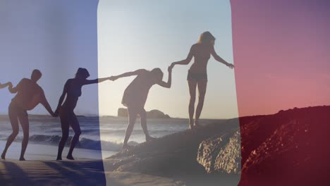 Animation-Der-Flagge-Frankreichs-über-Verschiedene-Freunde-Am-Strand