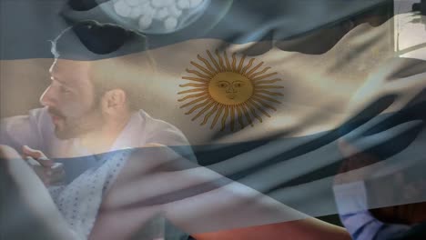 Animation-of-argentina-flag-over-caucasian-male-surgeon-operating-pregnant-woman-during-delivery