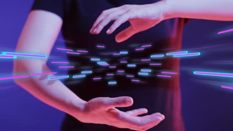 Animation-of-glowing-light-trails-of-data-transfer-and-asian-woman's-hands
