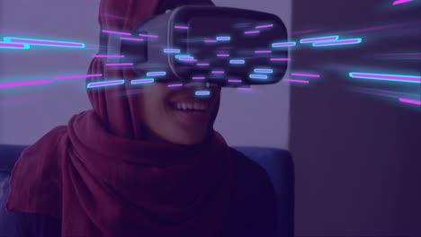 Animation-of-glowing-light-trails-of-data-transfer-over-biracial-woman-in-vr-headset