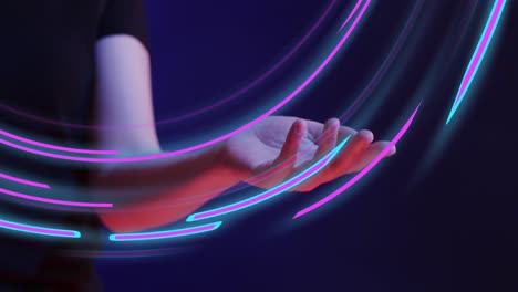 Animation-of-glowing-light-trails-of-data-transfer-and-asian-woman's-hand