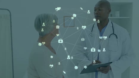 Animation-of-network-of-connections-over-african-american-male-doctor-with-female-patient