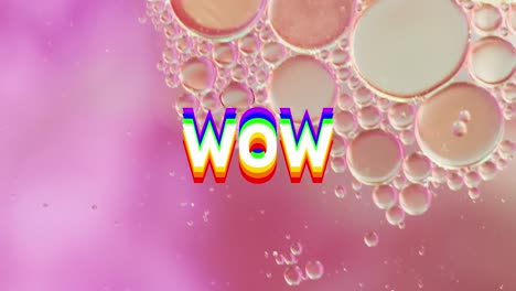 Animation-of-wow-text-over-close-up-of-liquid-and-baubles