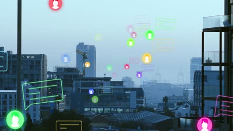 Animation-of-multiple-message-and-profile-icons-floating-against-aerial-view-of-cityscape