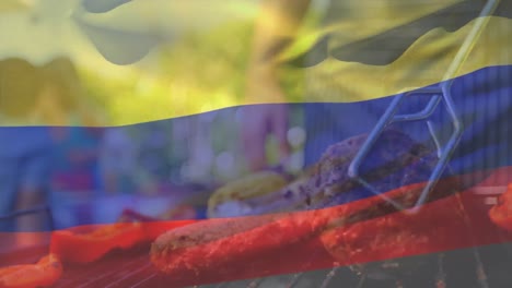 Animation-Einer-Kolumbianischen-Flagge,-Die-über-Dem-Mittelteil-Eines-Kaukasischen-Mannes-Weht,-Der-Fleisch-Auf-Dem-Grill-Grillt