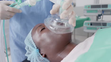 Sleeping-african-american-female-patient-with-oxygen-mask-during-surgery-in-slow-motion,-unaltered