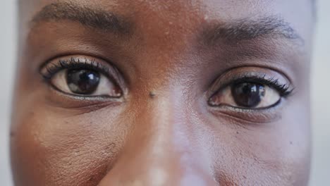 Close-up-of-the-opening-eyes-of-african-american-female-hospital-patient,-in-slow-motion