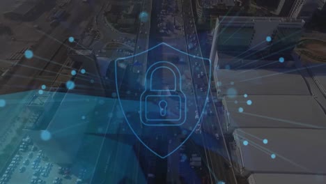Animation-of-security-padlock-and-blue-spots-against-aerial-view-of-cityscape